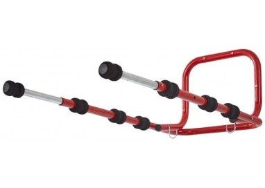 Soporte plegable de pared para 4 bicicletas instalado en un garaje, mostrando las bicis organizadas y el espacio liberado.